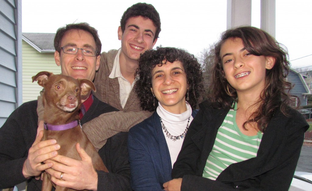 Andy, Jonah, Rachel, Talia, and dog Choco on the porch of their Nyack home.